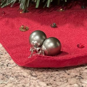 Genuine Tahitian black pearl pierced earrings.